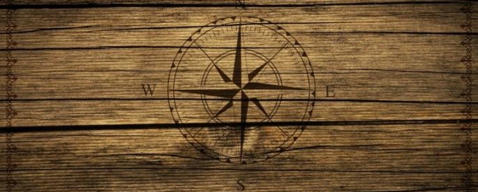 compass drawn on a wooden background