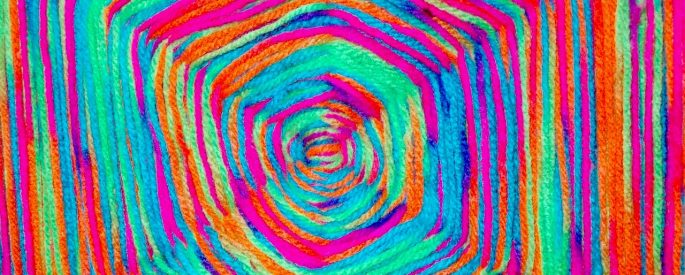 Rainbow yarn in a God's eye pattern