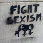 Photo of graffiti on concrete wall reading "Fight Sexism"