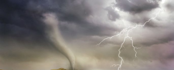 Photo of a tornado and lighting strike in a small village