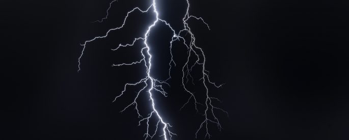 Flash of lightning against a black sky