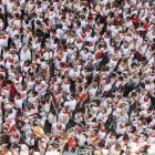 A bird's eye view of a crowd of people dressed in red and white