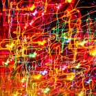 Photograph of abstract art made by dozens of lines of neon light