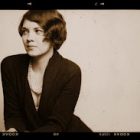sepia portrait of Carrie O. Adams, who looks away from the camera