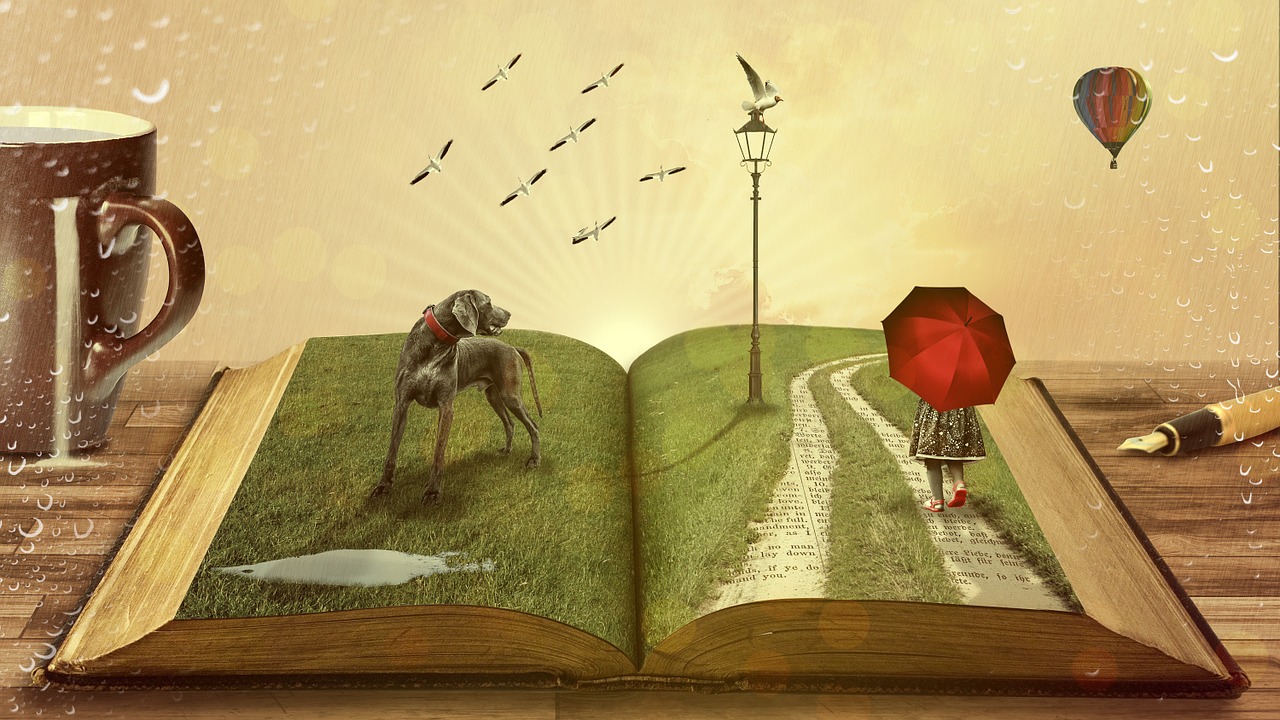 Open book with abstract elements - a pen and coffee mug sit next to the book on the table, but leaping out of the open book are a hot air balloon, flying cranes; a lamp post, a child with a red umbrella, and hound dog 