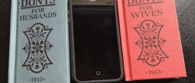 two small copies of the books "Dont's" for Husbands and Wives lay beside an iPhone for comparison, showing that the two small marriage manuals are the size of an iPhone
