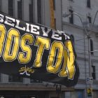 a Believe Boston glad in black and yellow color scheme