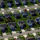 photo of rows of suburban, cookie-cutter houses, situated extremely close together