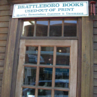 photograph of the outside of BrattleBoro Books, with a bookstore sign, a subtitle reads: "Used & Out of Print"