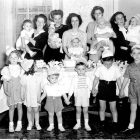 Vintage picture of a large group of children and mothers, celebrating a child's birthday