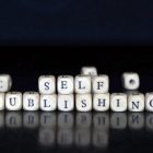 Black background with white blocks spelling out "Self-Publishing"