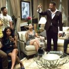 A still from the TV show Empire, showing the cast in a living room as one character makes a toast