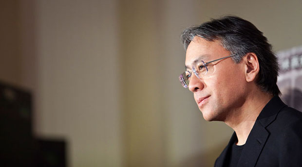 Partially profile photo of an Asian man wearing glasses