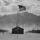 American flag in front of a prison camp