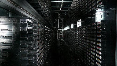Black and white picture of filing cabinets full of CDs. 