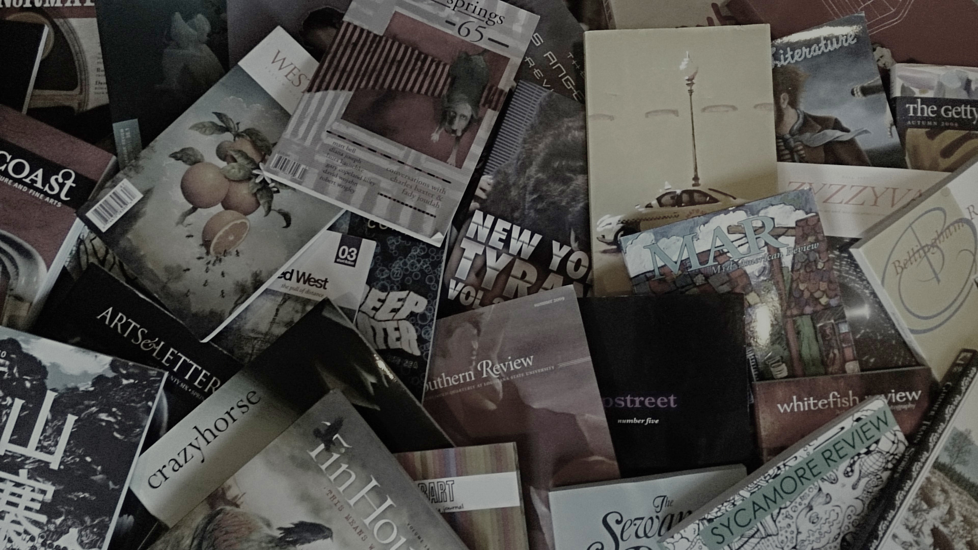 Many literary magazines spread on the floor cover up.