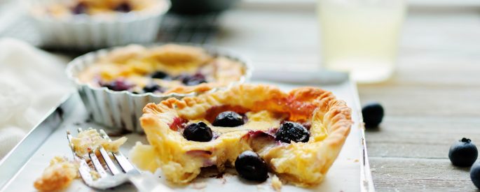 pie with berries beside fork