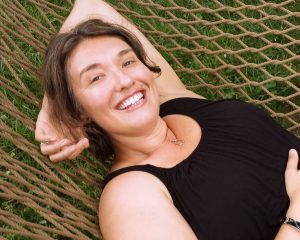 Picture of Julie Marie Wade lying on a hammock 