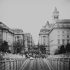 grayscale photo of people in city