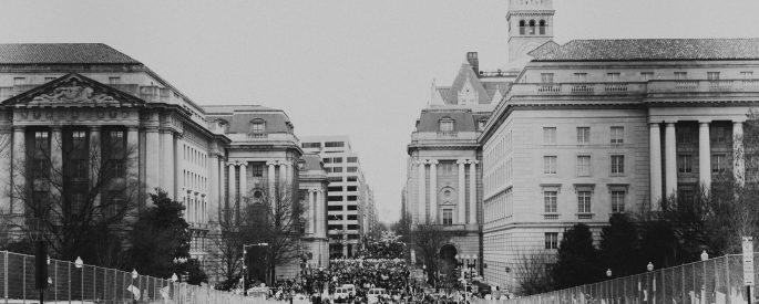 grayscale photo of people in city