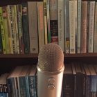 microphone in front of bookshelf