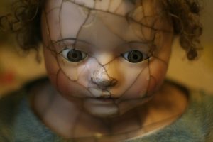 doll with cracked face 
