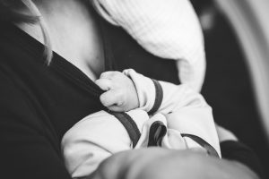close up of woman holding baby 