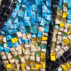 tile mosaic with blue, yellow, green, beige, and black
