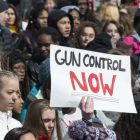March for Our Lives student protest, a sign reads "gun control now"