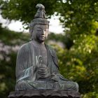 Photograph of an old Buddha statue outdoors