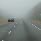 a photograph of a car driving down I-10 in Florida
