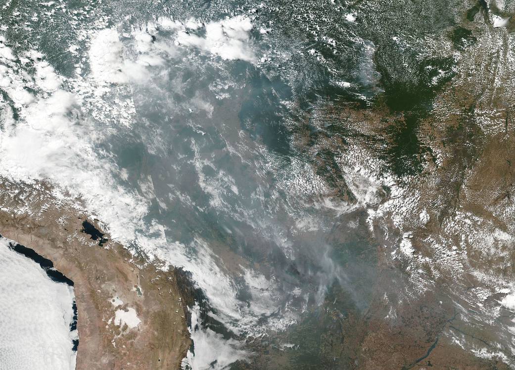 a satellite image of smoke and fires in the Brazilian rainforest