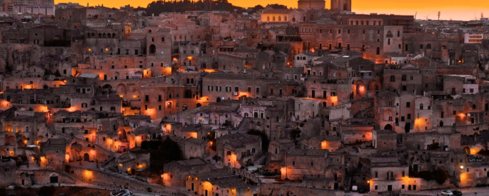 a photograph of an old Italian city at sunset