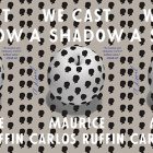 the book cover for We Cast a Shadow by Maurice Carlos Ruffin featuring a white apple with black silhouettes of a head on it