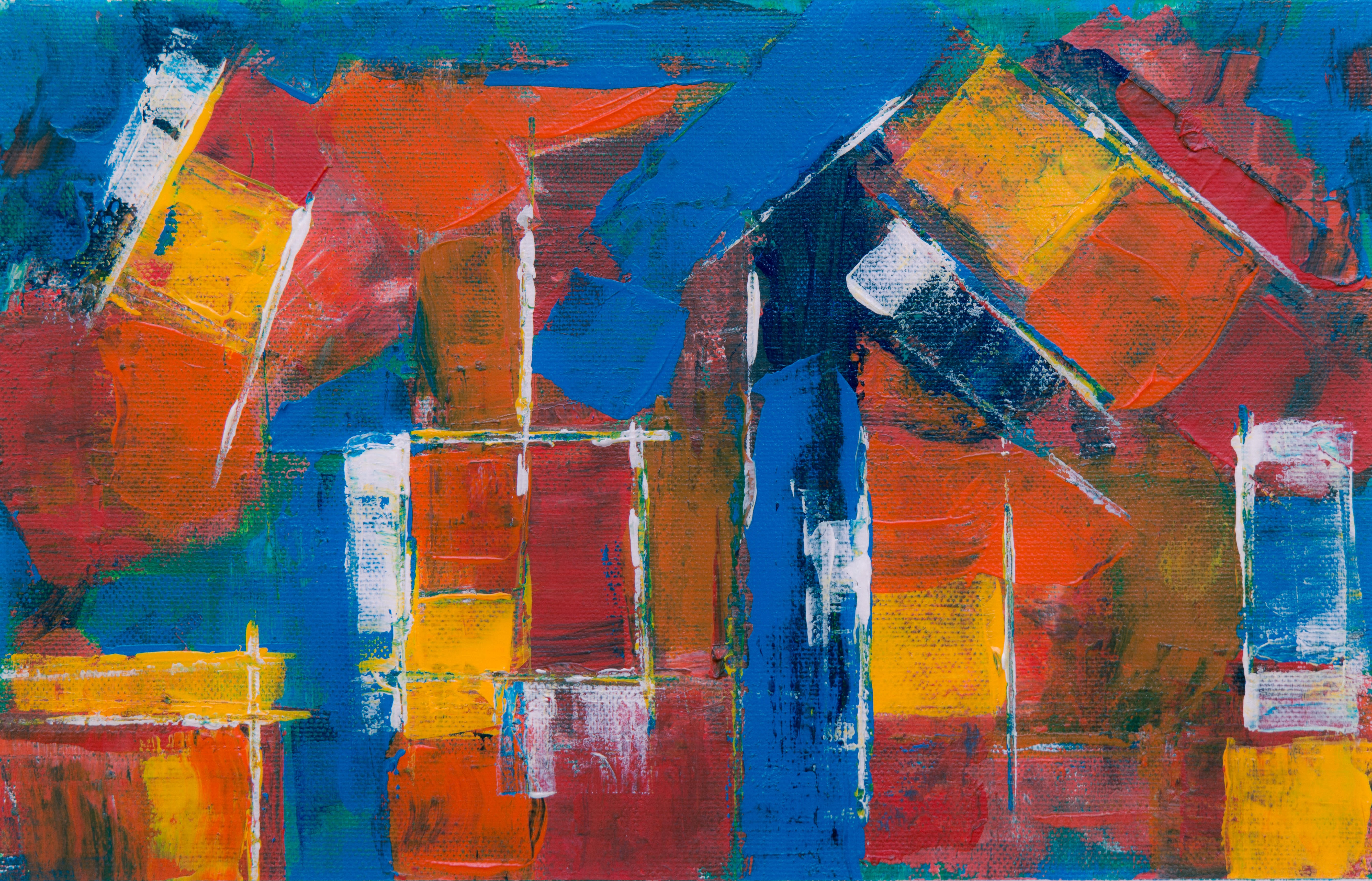 a painting featuring red, orange, and yellow squares on a blue background