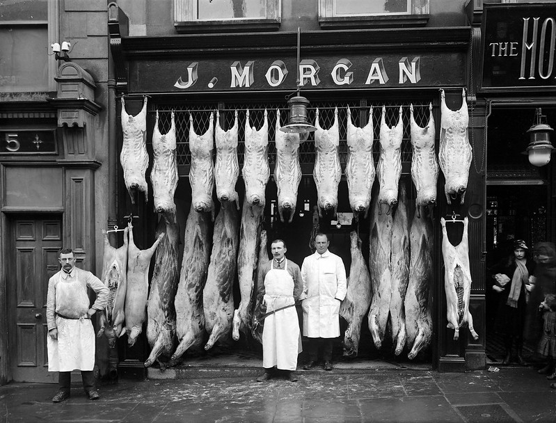 black and white photograph of butcher shop from 1916