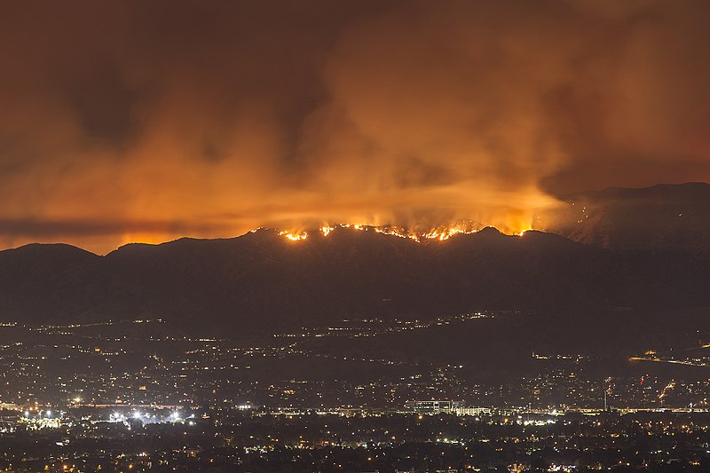 image shows the La Tuna fire above the nighttime city limits of Los Angeles