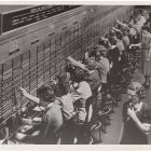 vintage black and white photograph of a line of telephone operators at work